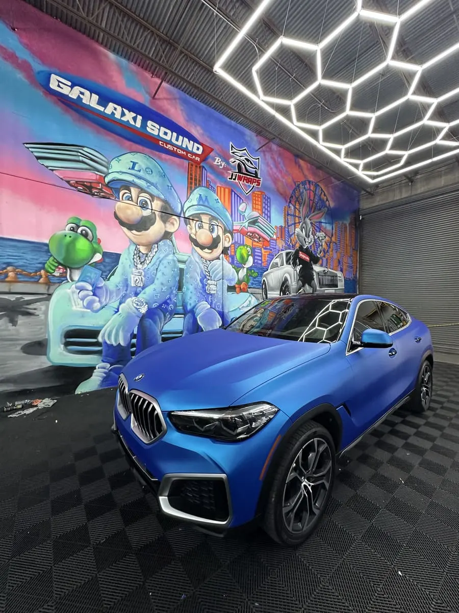 After: BMW X6 matte blue full wrap by Galaxi Sound Miami